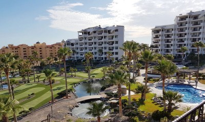 Casa Blanca gardens, pond, putting course, and pool