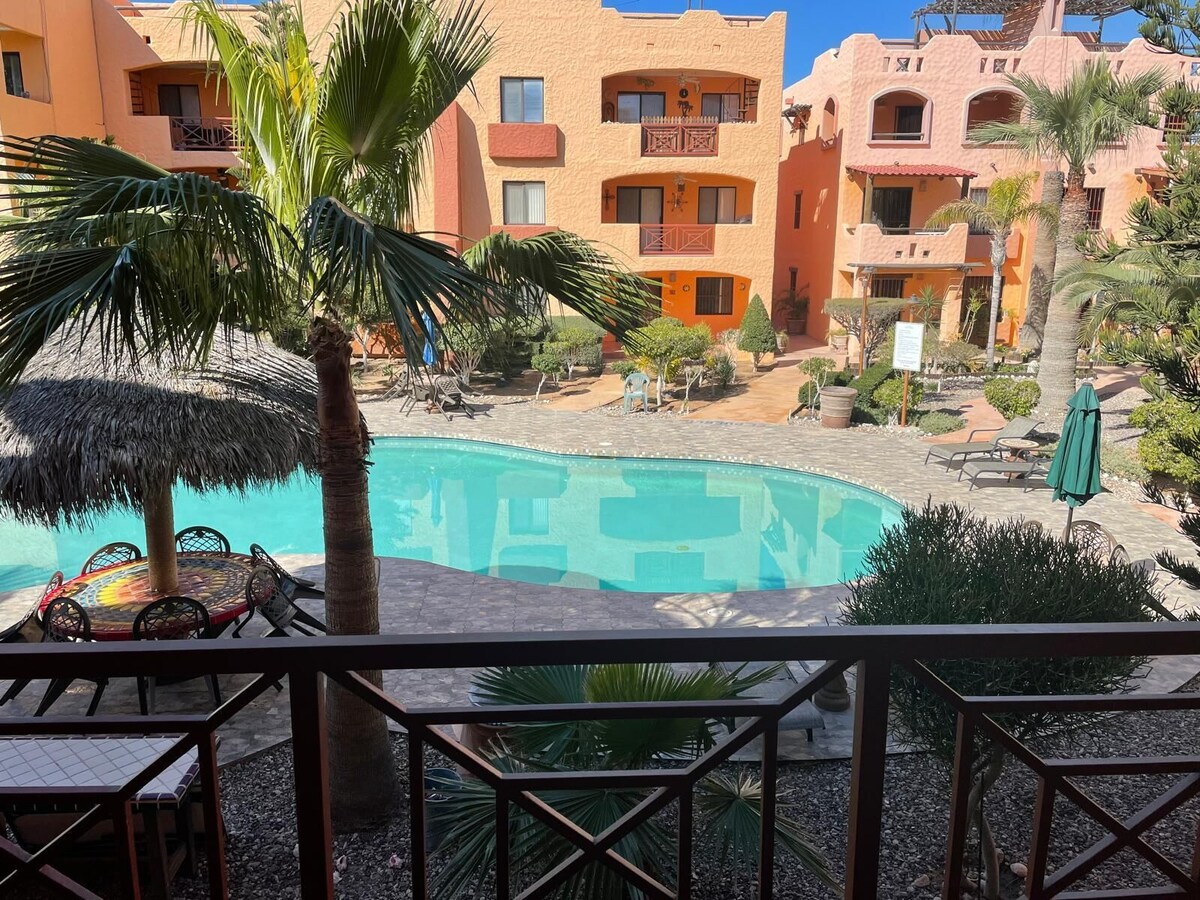 El Pueblo pool and courtyard viewed from a private balcony