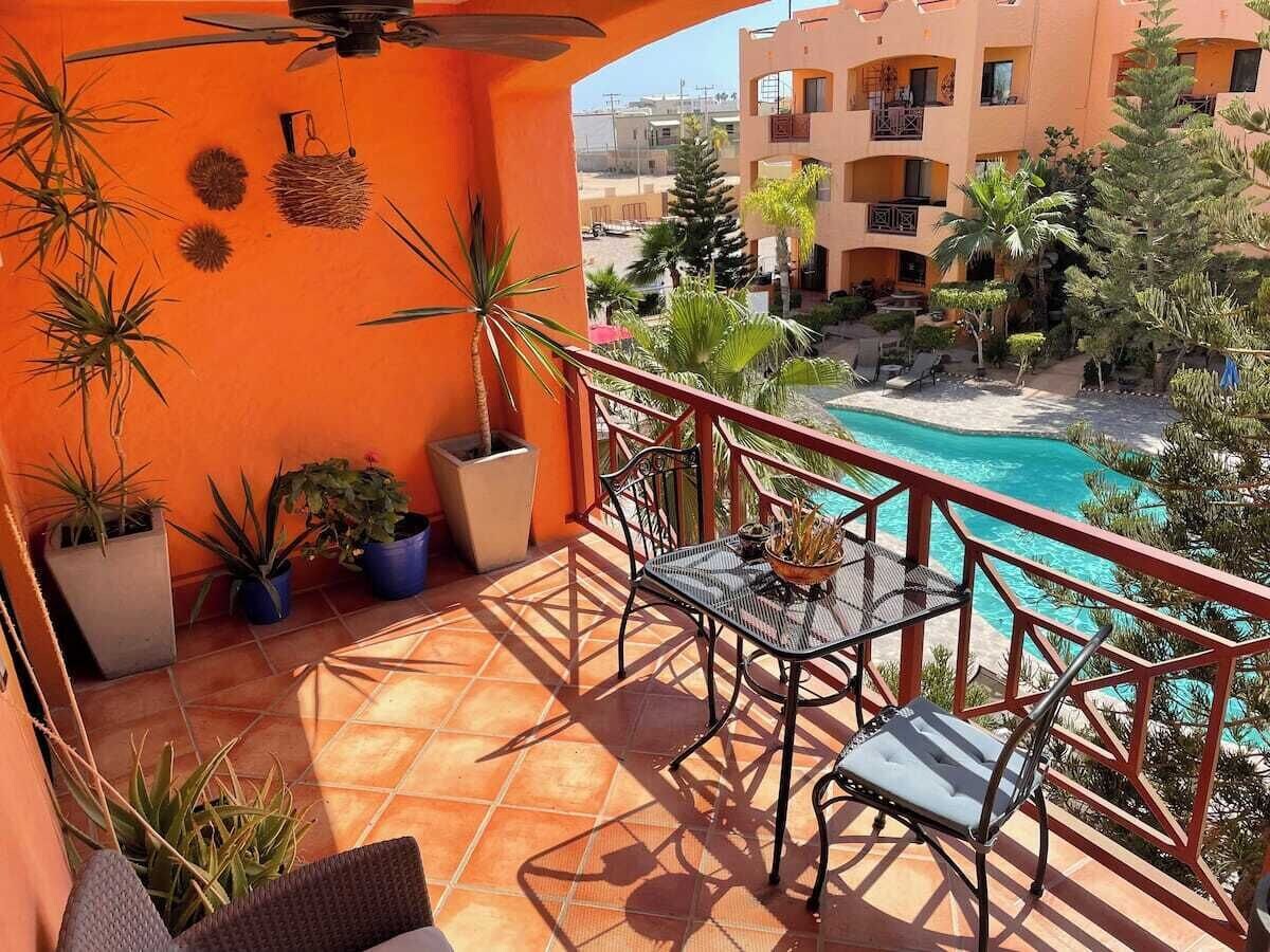 Furnished private balcony overlooking the pool