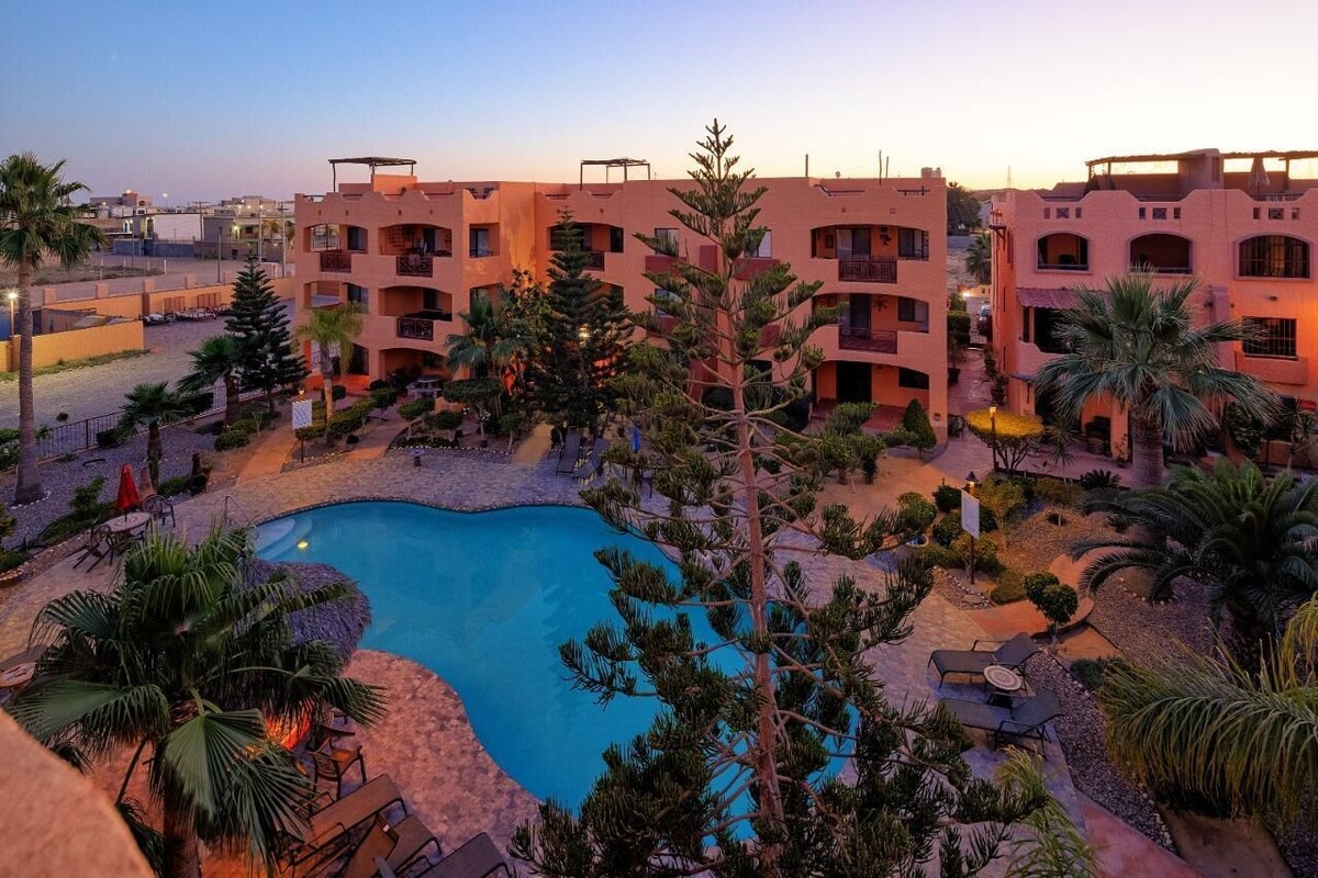 El Pueblo courtyard and pool around sunset