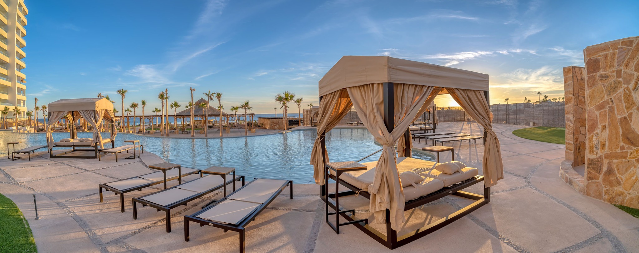 Poolside cabanas at sunset