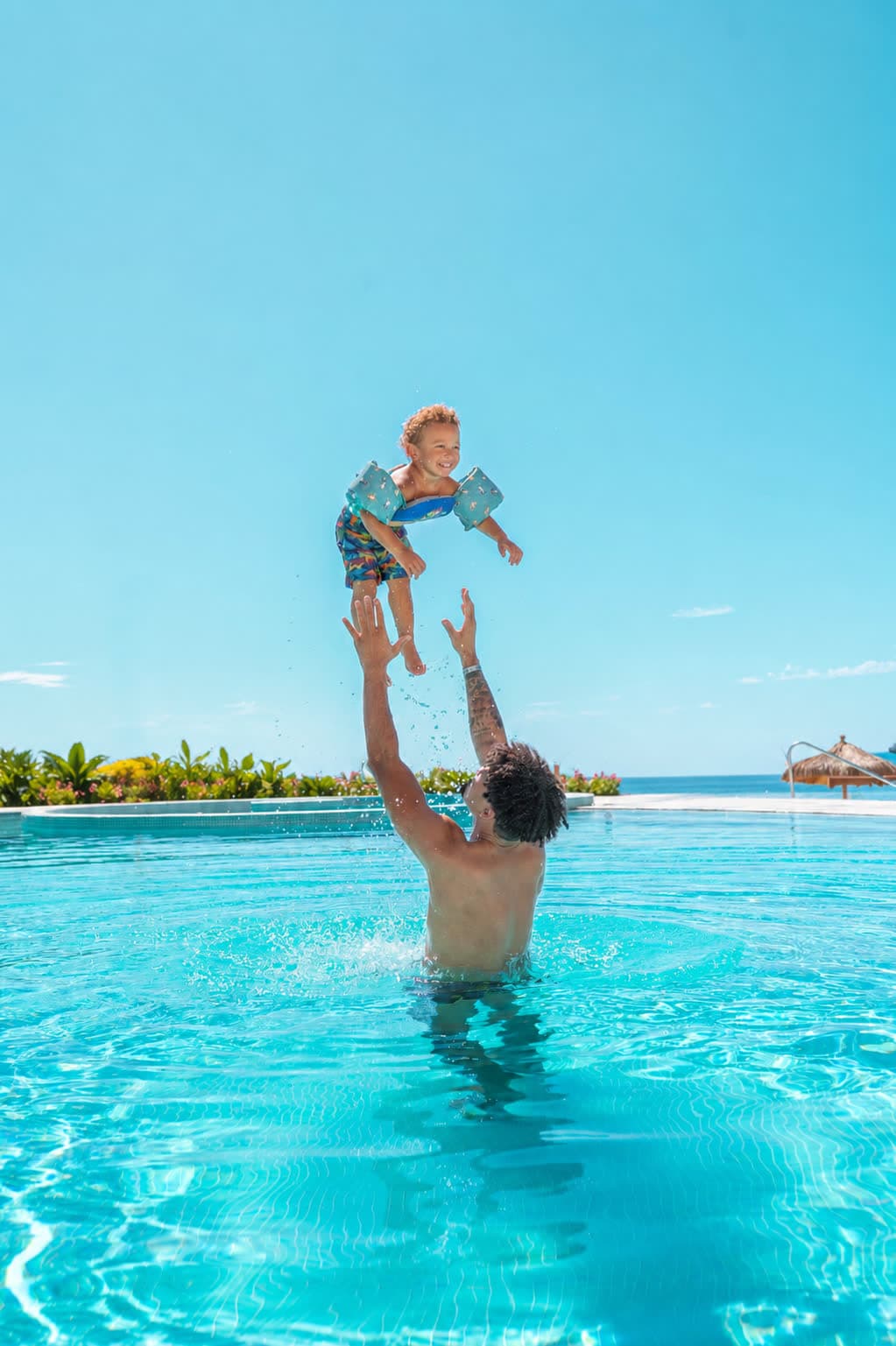 Family enjoying a Sonoran Star swimming pool