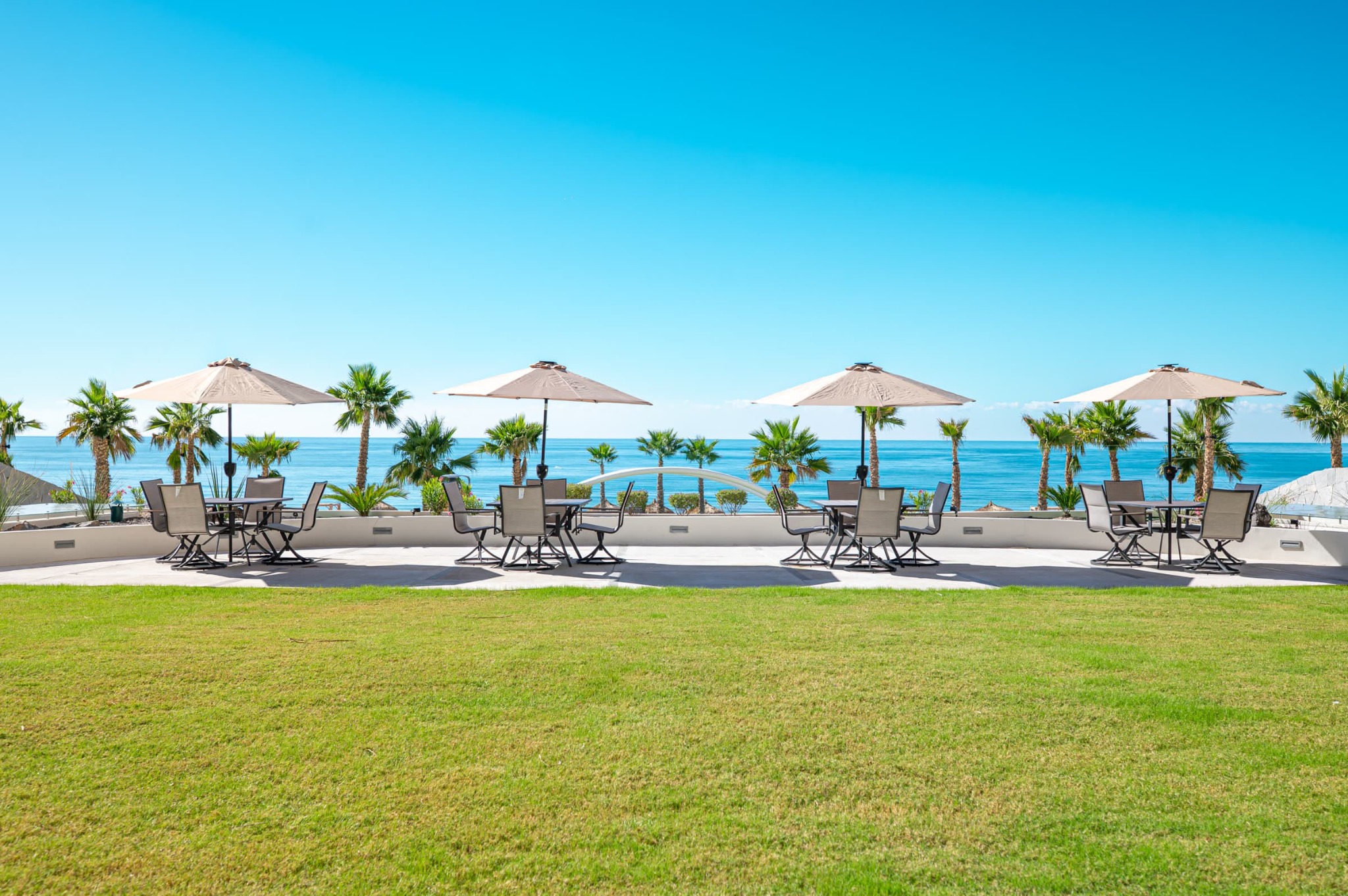 Ocean-view lawn and outdoor seating at Sonoran Star
